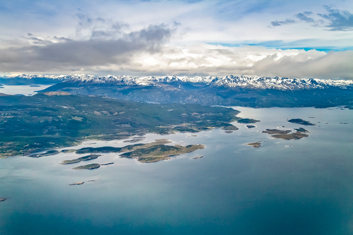 Aerial view of Ushuaia mountains and ocean
